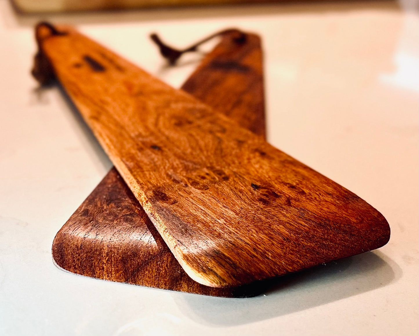 Sanded very smooth with a rounded edge.